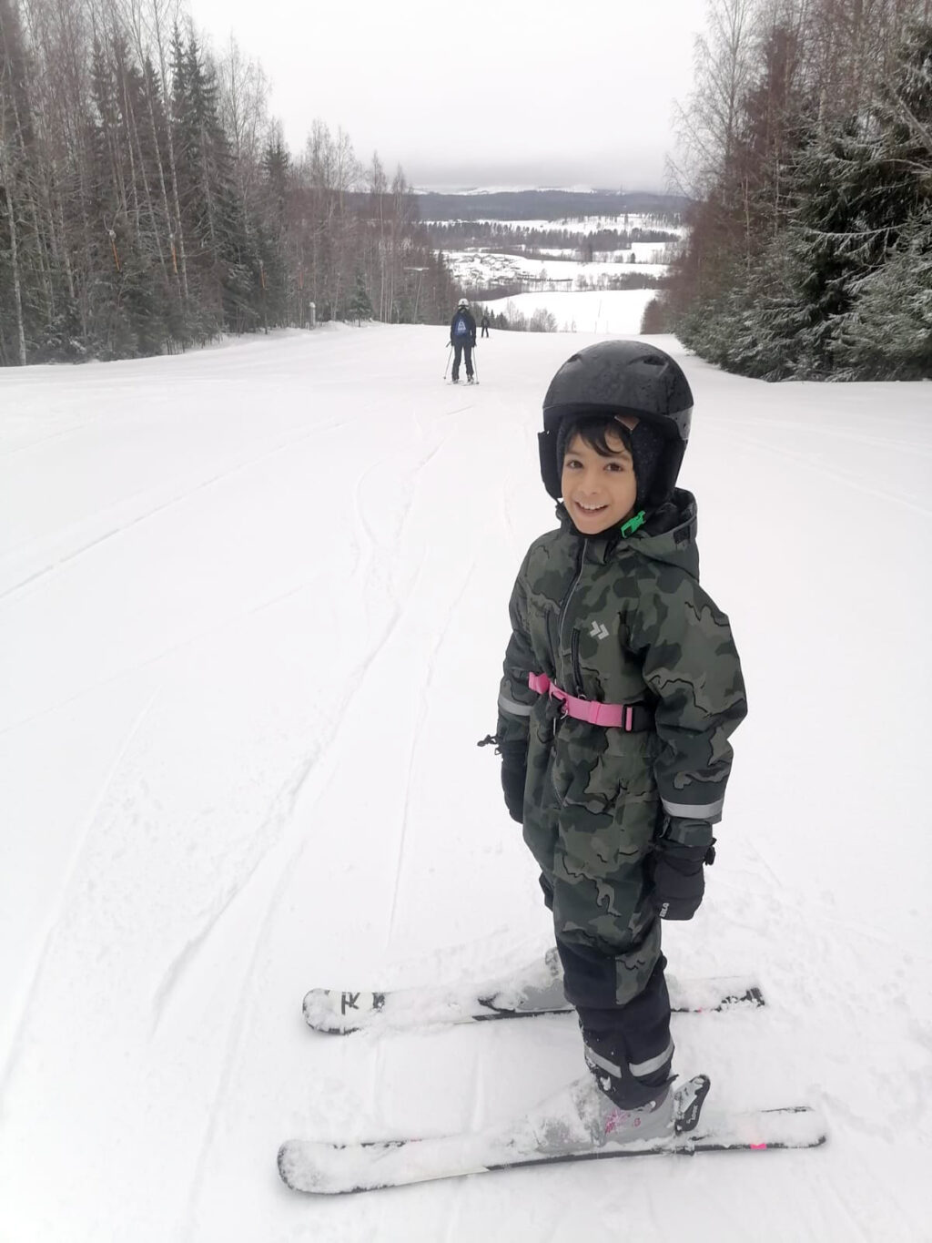 A child is going to do down hill skiing.